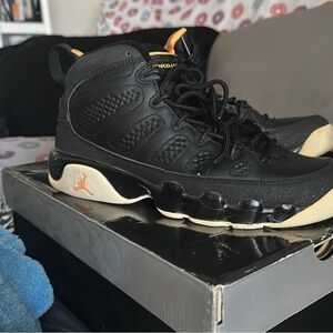 Black and Gold Air Jordan Sneakers